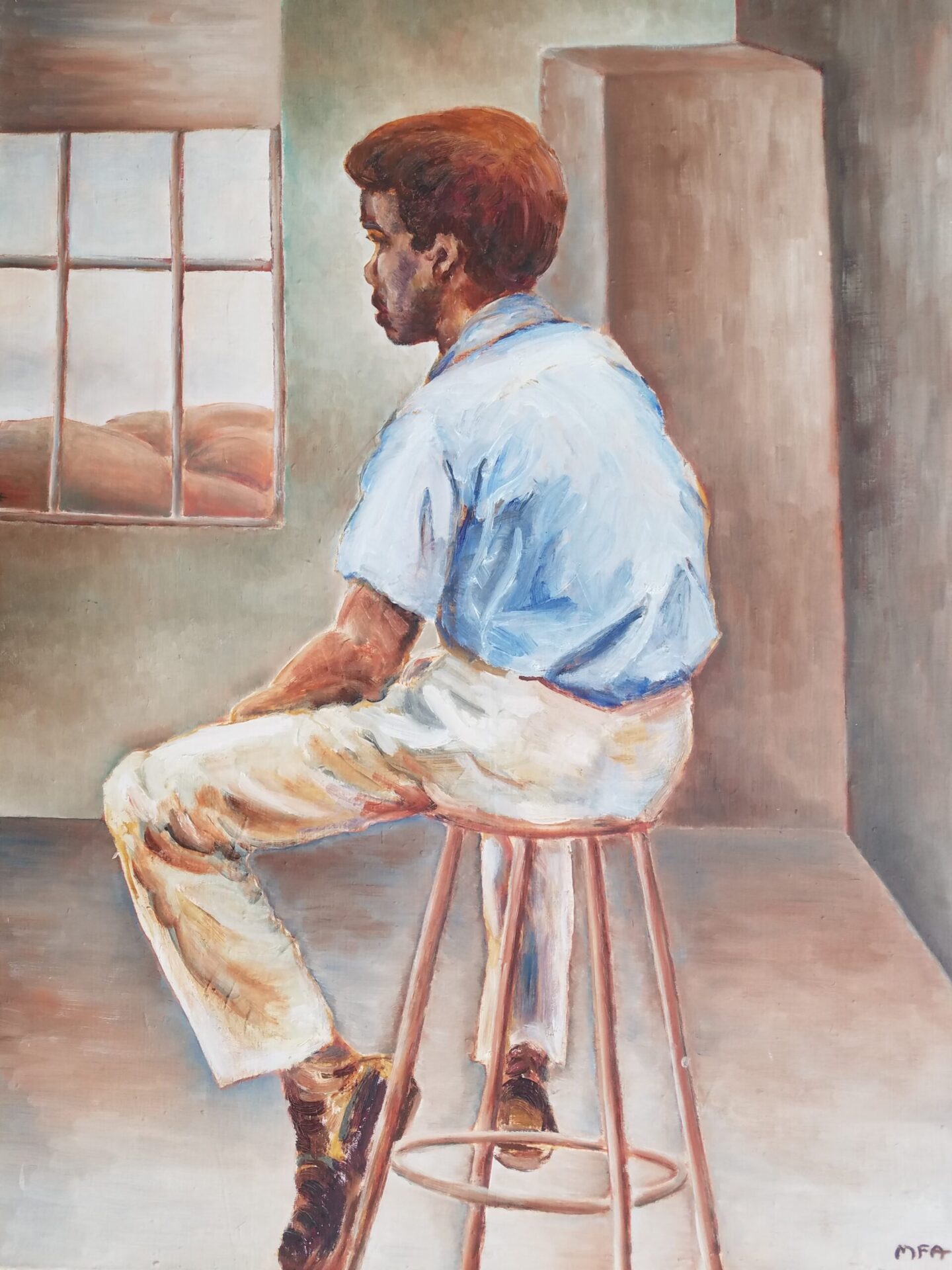 A boy in light colored pants and a powder blue shirt sits on a stool facing away from us toward a window.