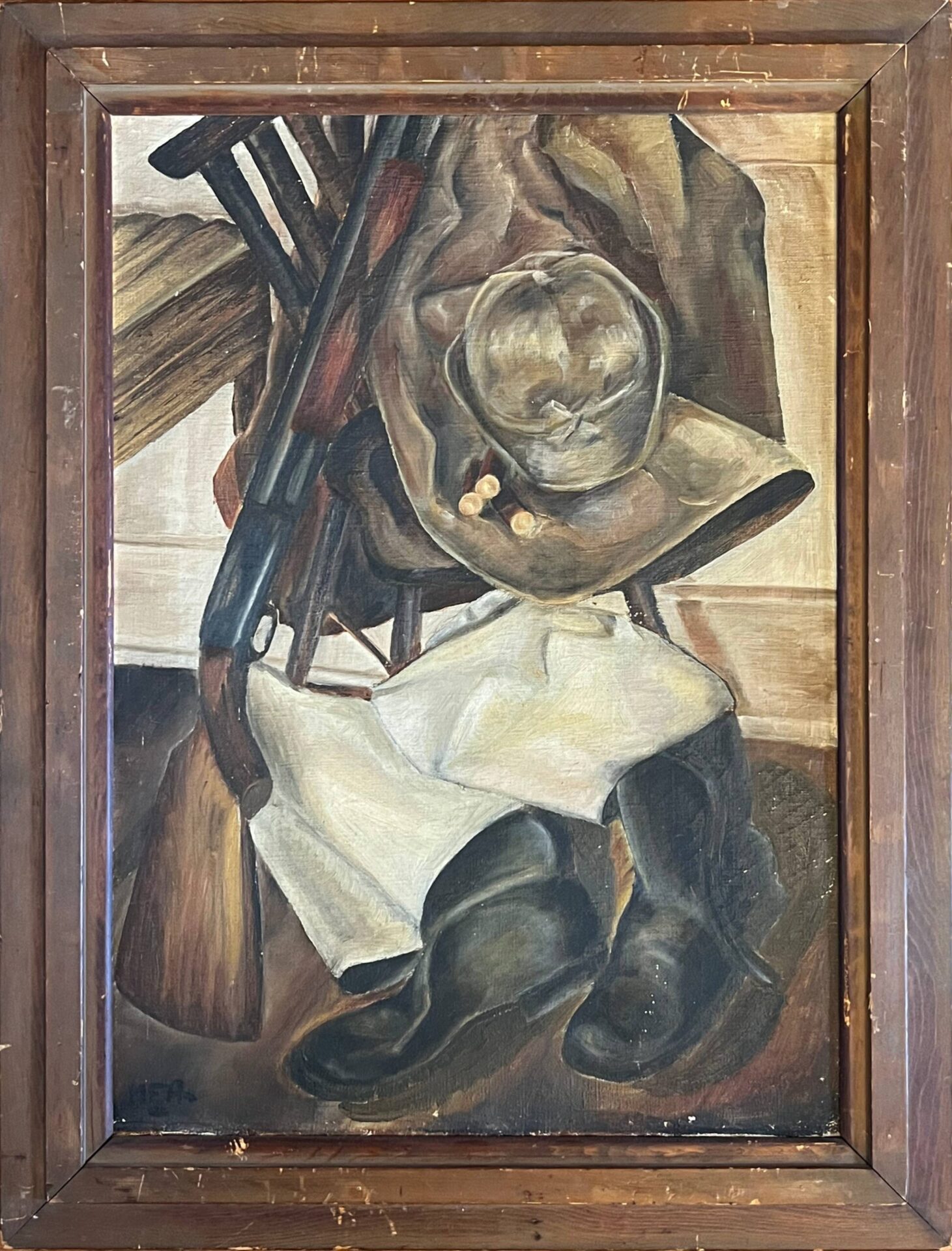 A shotgut leans against a chair with hunting clothes. Three shotgun shells rest on the brim of a the hat.