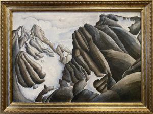 Grey and brown slabs of mountain reach through a covering of snow.