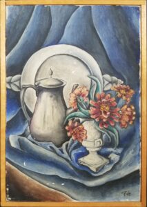 Blue cloth draped on what appears to be a chair with a vase of flowers, pweter pitcher, and serving plate arranged atop.