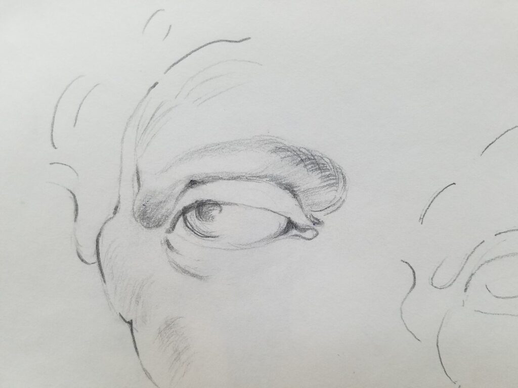 Sketch Diary 9 A page from sketch diary notebook with pencil drawing part of a person's face